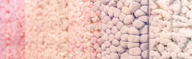 Pastel pink and purple marshmallows in a shop window