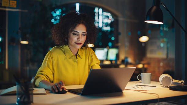 istock Successful Arab Female Sitting in Creative Agency Alone in the Evening, Manager Working on Implementing Business Strategy for Client. Excited Specialist Writing Corporate Project Plans on Computer. 1481146452