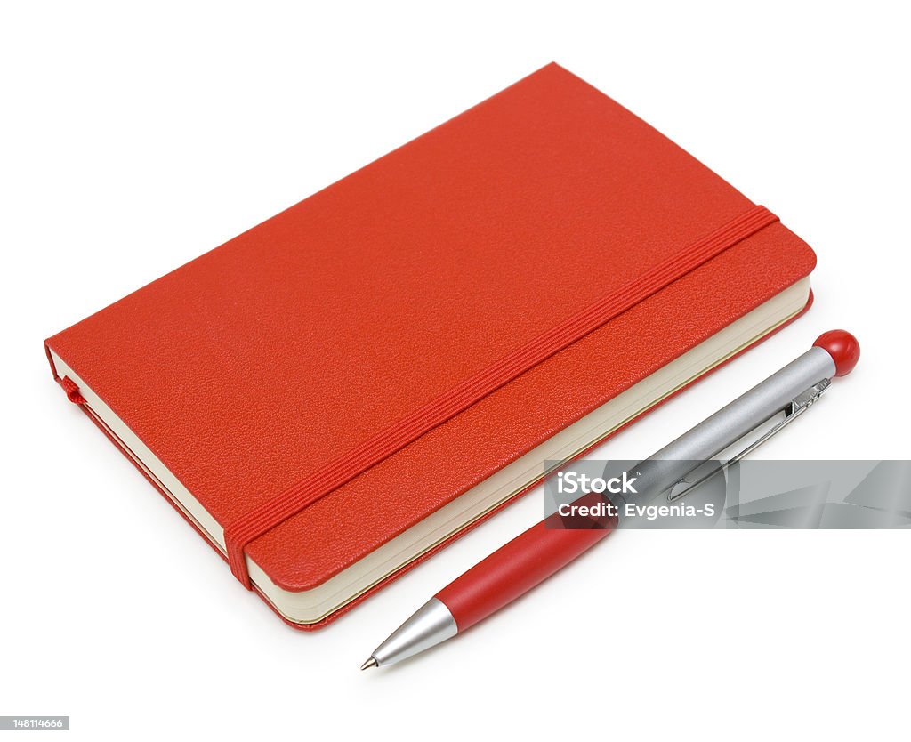 Red closed notepad  and pen isolated on white Red closed paper notepad and pen isolated on white background. Bright Stock Photo