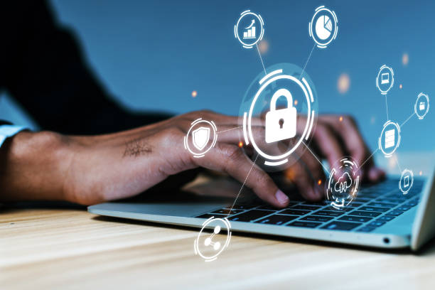 istock Cyber Security. business man hand working on laptop computer with virtual graphic icon diagram on desk at office, contact us, digital marketing, business finance, internet network technology concept 1481147483