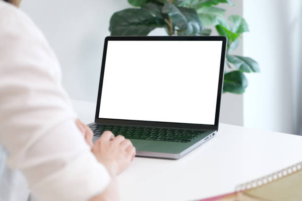 istock Woman using laptop computer with blank screen for mock up template background, people business technology and lifestyle background concept 1481147776