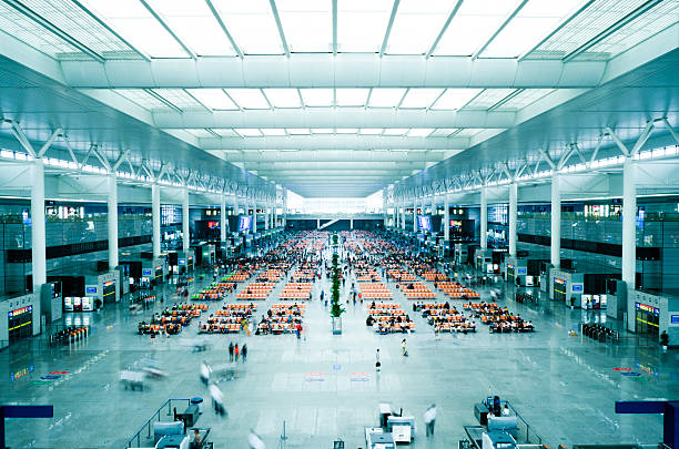 people waiting in the hall of railway station