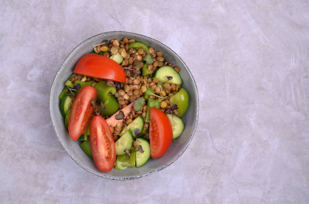 istock Salad slices of raw vegetables with lentils 1481149812