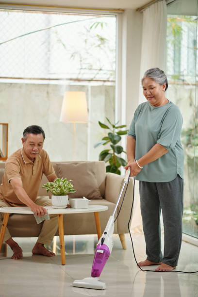 istock Senior Couple Cleaning Apartment 1481150030