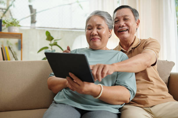 istock Aged Couple Watching Comedy Movie 1481150044