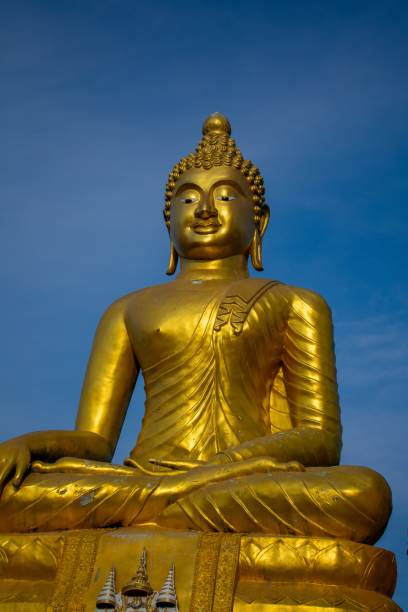 istock Golden Buddha statue against a blue sky. 1481151687