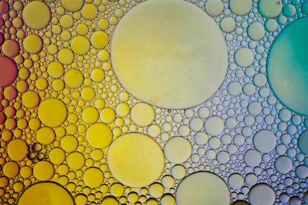 istock multi colored oil circles on the water, colorful background 1481152923