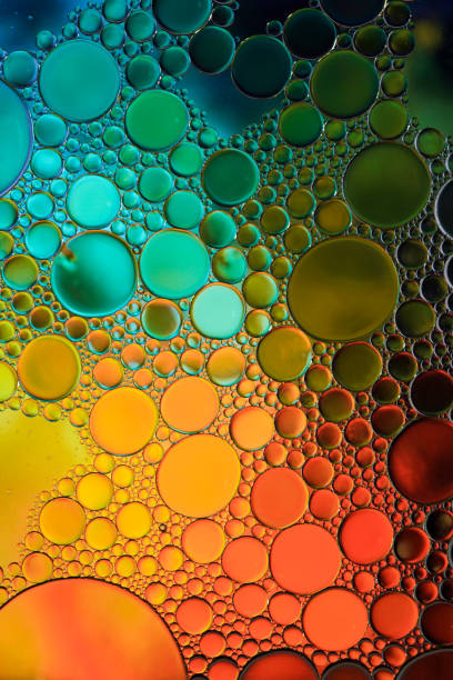 istock multi colored oil circles on the water, colorful background 1481152929