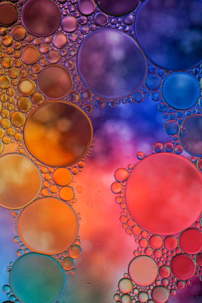 istock multi colored oil circles on the water, colorful background 1481152932