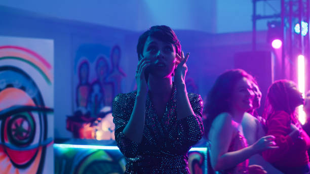 istock Woman answering phone call at party 1481153213