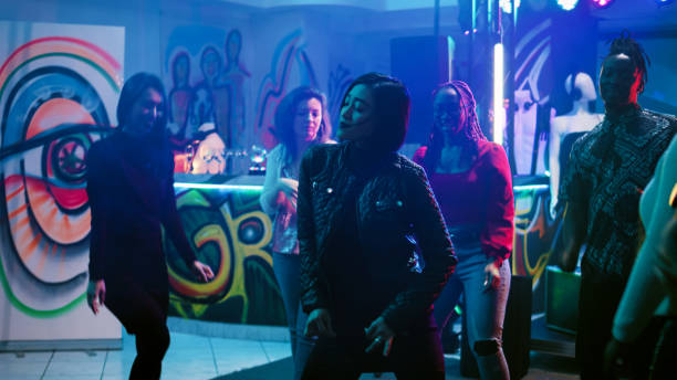 istock Young group of people dancing on music 1481154212