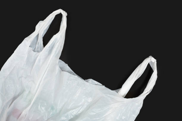 istock white plastic bag on black background. A White Plastic Bag Texture, macro, background. Reduction of plastic bags for natural treatment. The symbol of the campaign to refrain from using plastic bags. 1481156490