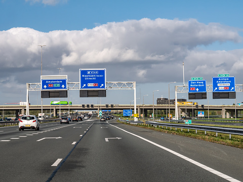 Direction information on overhead gantries, orbital motorway A2 traffic junction Oudenrijn, Utrecht, Netherlands