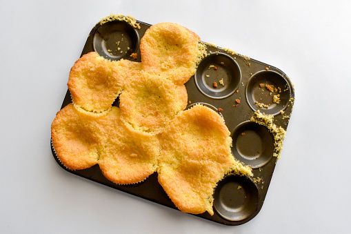 Muffins fail on the baking tray.  Cooking preparation concept.
