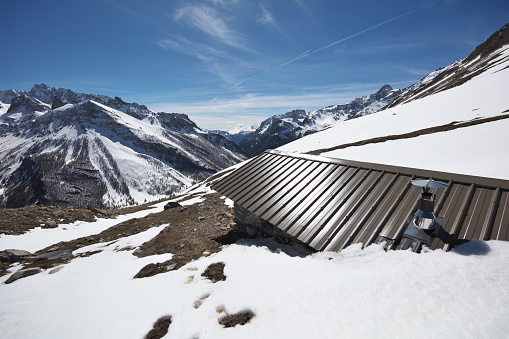 This recently renovated cabin is at an altitude of 2450m, it is located halfway through the path which leads to the 2661m collar from Maljasset in Haute Ubaye.\nThe photo is taken towards the southwest southwest towards the head of half-day 2689m to the left of the image with in the background the Aiguille de Chambeyron 3412m