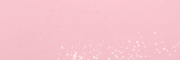 istock Sparkling silver glitter on pink background banner 1481164434