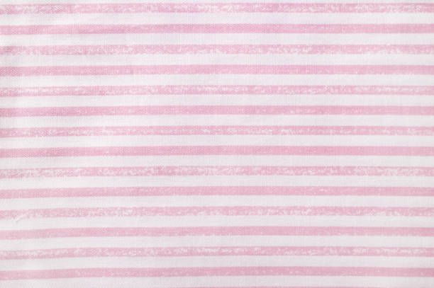 istock Pink and white striped cotton texture, fabric textile background 1481165026