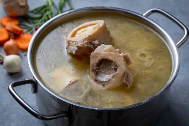 istock Boiled bone and broth. Homemade beef bone broth is cooked in a pot on. Bones contain collagen, which provides the body with amino acids, which are the building blocks of proteins. 1481165077