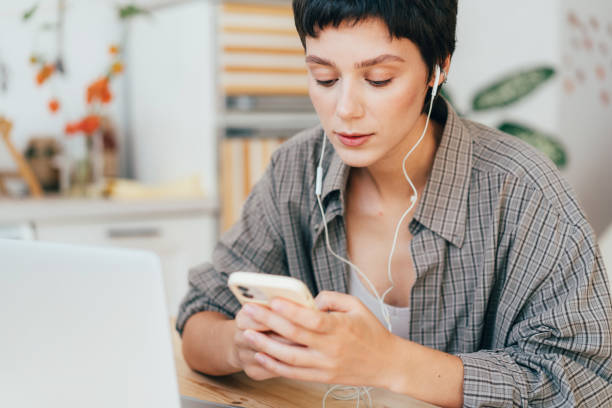 istock A woman writes a message on a mobile phone. 1481165112