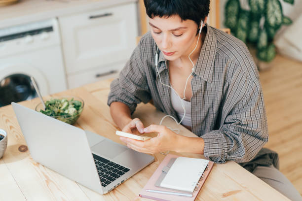 istock Young business woman sitting at the table working using gadgets. 1481165119