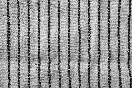 Classic black and white striped kitchen towel texture. Fabric textile background with visible weave and thread detail. Ideal for web, print, packaging or for any other design project