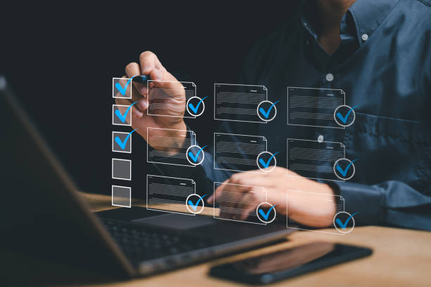 istock Electronic smart checklist and document management on virtual screens concept, Businessman using laptop marking online checklist document and customer satisfaction survey 1481170012