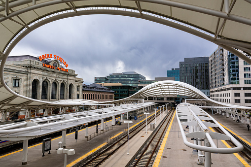 March 25, 2023 - Denver, Colorado - The renovated train station and tracks of Union Station under a cloudy sky on a late winter afternoon.