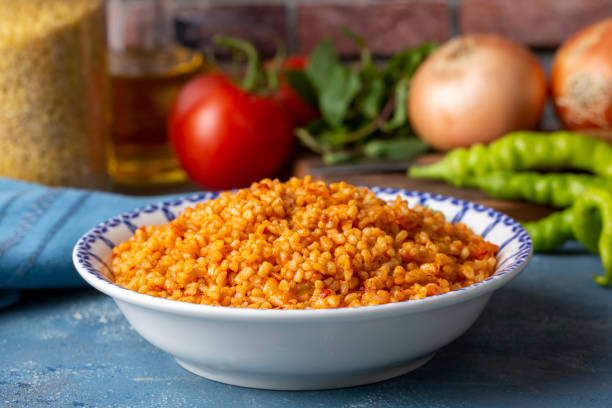 istock Traditional turkish bulgur pilaf with tomato sause in plate (Turkish name; meyhane pilavi) 1481174389