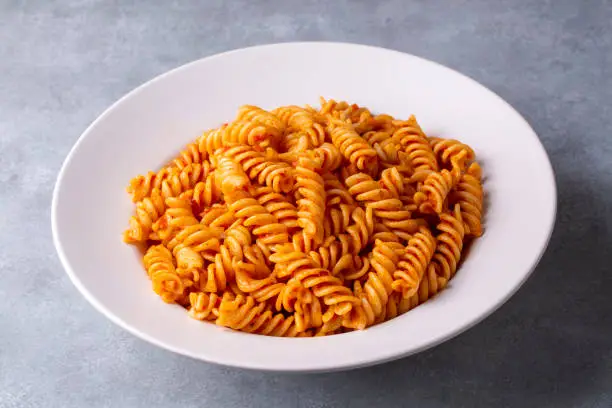 Fusilli pasta, spiral or spirali pasta with tomato sauce - Italian food style