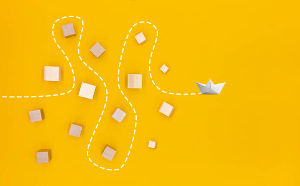 istock a paper boat that passes through obstacles and advances to its goal 1481175736