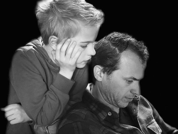 istock Father and son chatting on smartphone 1481175847