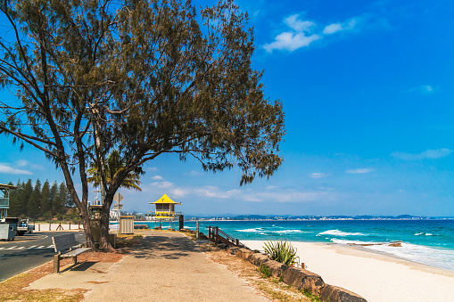 Panoramic view of the road along the Rainbow Bay Beach, one of the most popular beaches on the Gold Coast, Queensland, Australia.