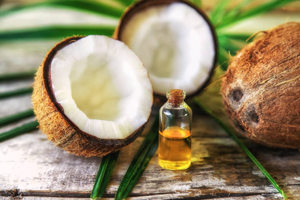 istock Natural coconut oil in a bottle. Selective focus. 1481181922