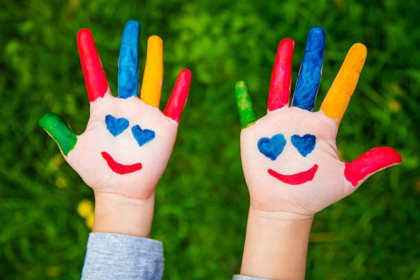 istock Smile on the hands of a child drawing. Selective focus. 1481181930