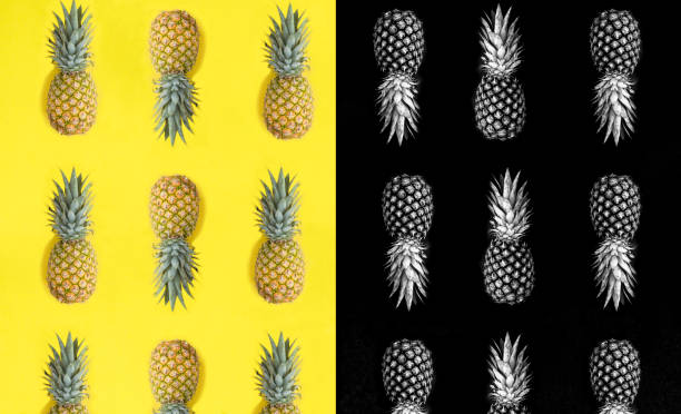 Collage. Pineapple on the black and yellow background. Flat lay. Pattern. Top view.
