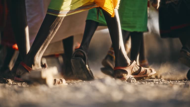 SLO MO Feet of Samburu people in local dresses gathers while performs tribal songs