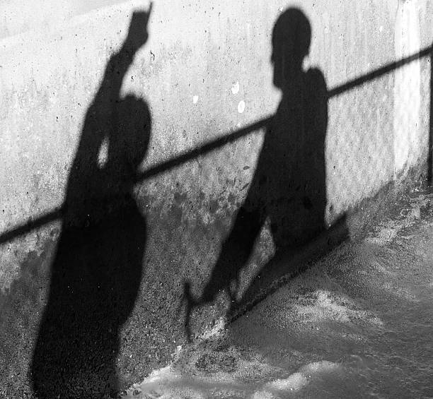 istock Silhouette of two men observing 148118979