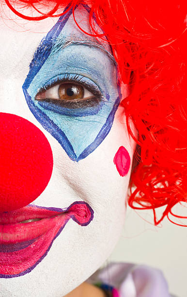 istock Half Clown Face Extreme Close Up on Bright Beautiful Female 148119012