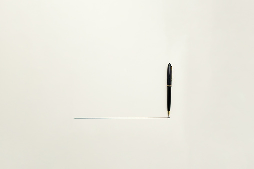 Conceptual - A blank space with a line and a pen pending a signature
