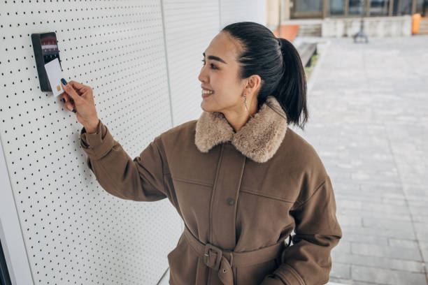 Woman scan cardkey to enter building One woman, Asian woman scan the security card to enter the building. Building Security stock pictures, royalty-free photos & images
