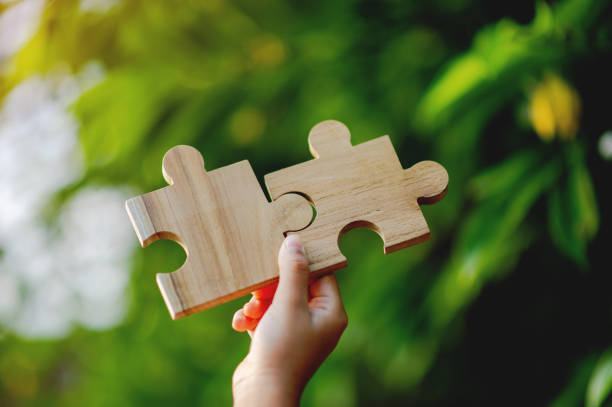 istock jigsaw puzzles put together jigsaw puzzles puzzle pieces join forces Unity and good teamwork 1481191791