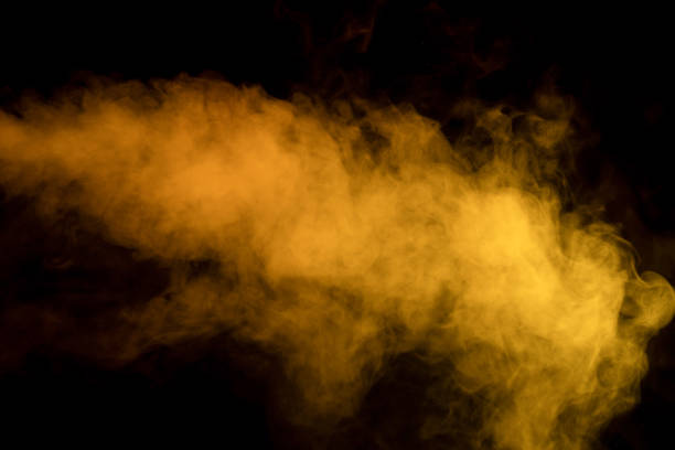 Orange and red steam on a black background. Copy space.