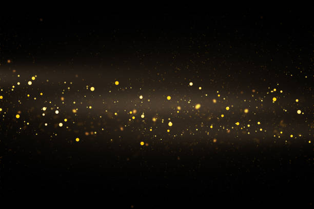 istock Gold sparkles and glitter on black background. 1481192049