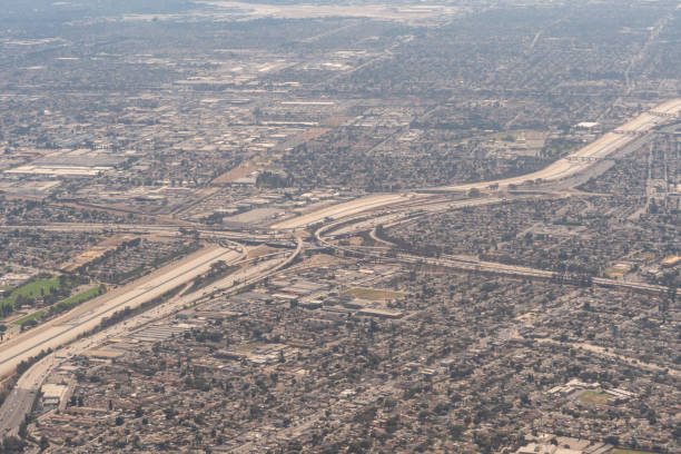 Aerial view of a freeway interchange 9/6/2022: Aerial view of a freeway interchange and the LA River in Southern California san diego freeway stock pictures, royalty-free photos & images