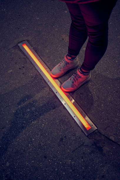 Integrated crosswalk stoplight for pedestrians in asphalt.