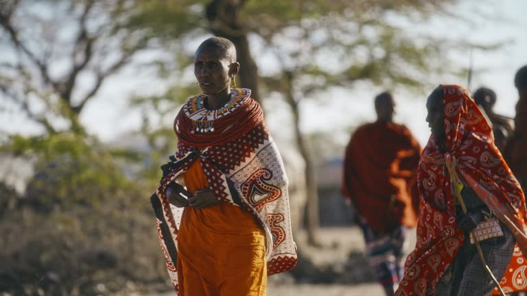 SLO MO Samburu women walks in the village for gathering
