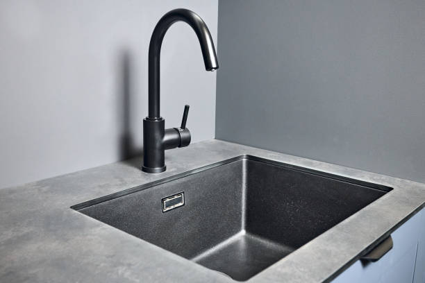 istock Single handle water filter kitchen faucet for reverse osmosis or water filtration system built in compact high pressure laminate HPL countertop. Kitchen undermount installation granite composite sink. 1481196617