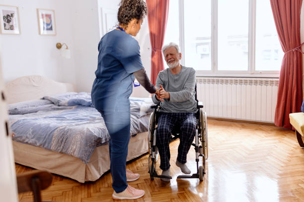 istock Healthcare worker giving support to a senior man 1481200367