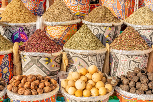 istock Different colorful spices in baskets on the shelves. 1481201038