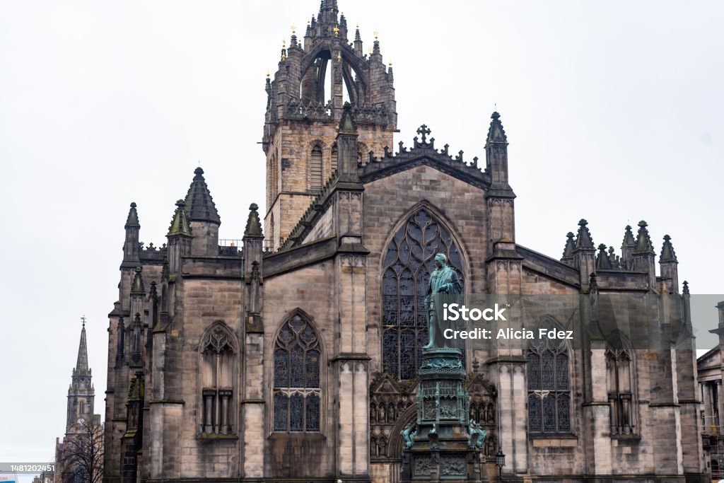 High Kirk in Edinburgh Saint Giles Cathedral or High Kirk in Edinburgh. Adam Smith's statue Adam Smith - Philosopher Stock Photo